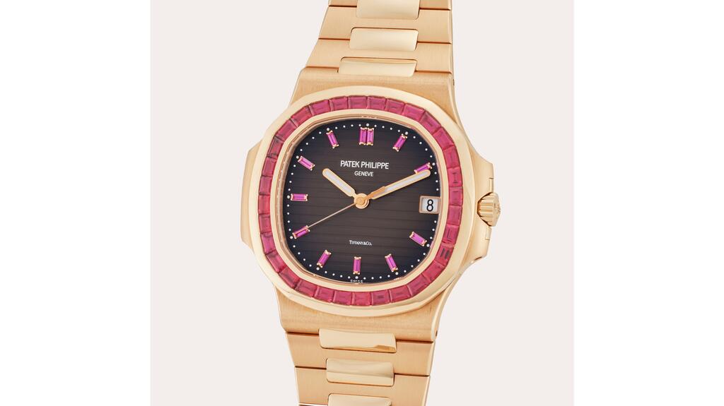 A watch featuring a baguette-cut, ruby-set bezel with a chocolate dial signed by both the maker Patek Philippe and the retailer Tiffany & Co. The watch is one of only two examples that have ever been brought to market, said Sotheby’s. Patek Philippe Tiffany & Co. watch